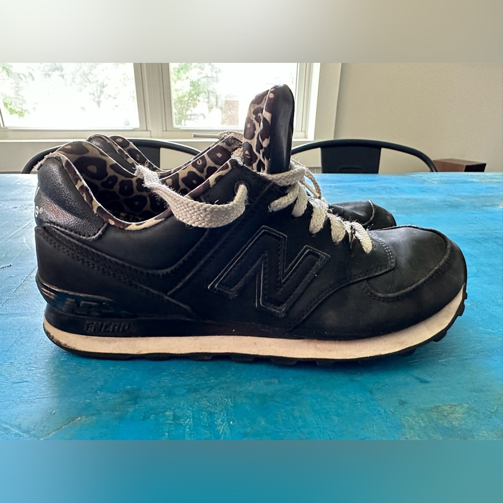 Women’s New Balance size 8.5 matte black outside, leopard inside. Used condition